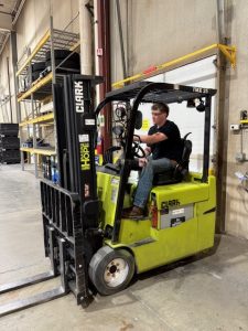 Nolan driving forklift at BTD