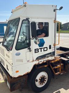 Bud driving truck at BTD